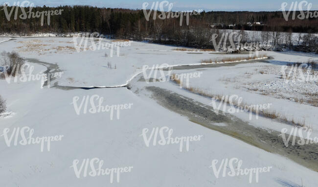 aerial view of a riverbank in winter