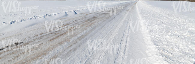 snowy road in sunlight