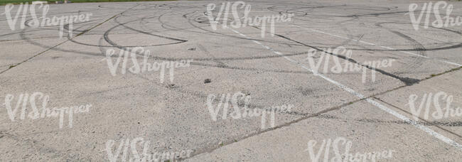concrete square with dark tyre tracks