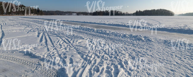 snow covered lake with skating track