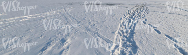 small path in a snow covered field