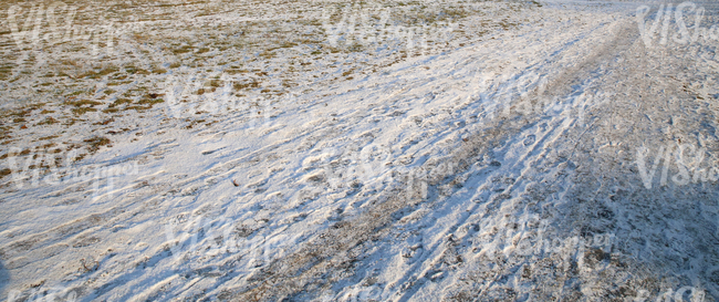 snow-covered ground with a pathway