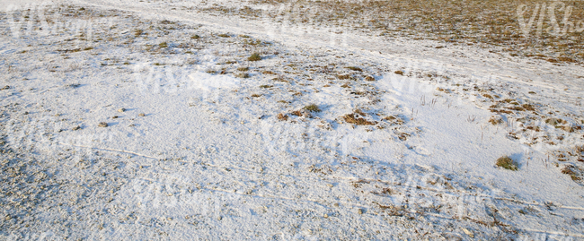 ground partially covered with snow