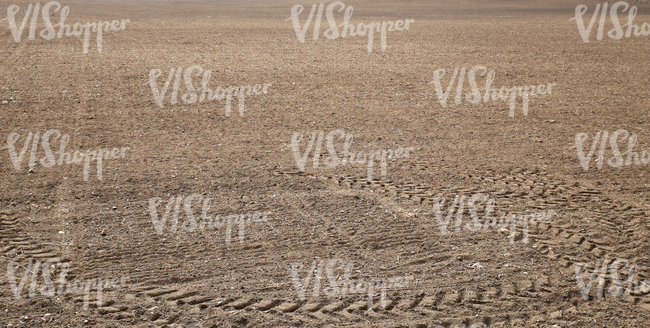 a field with tractor tracks