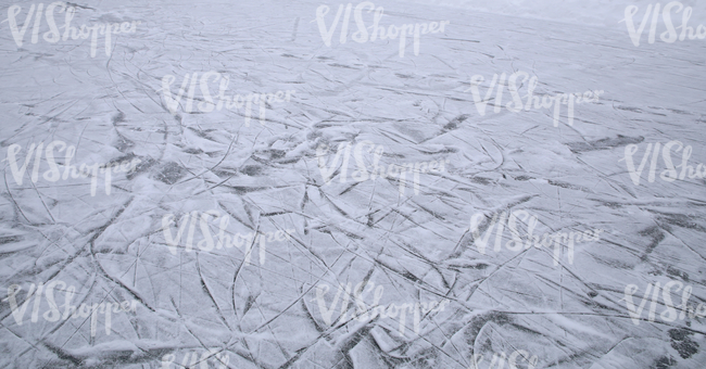 field of ice with skating tracks