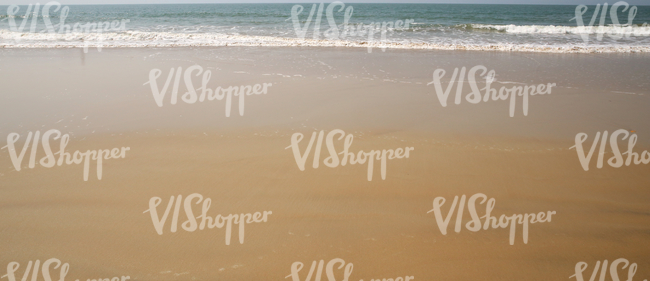 waves on a sandy ocean beach