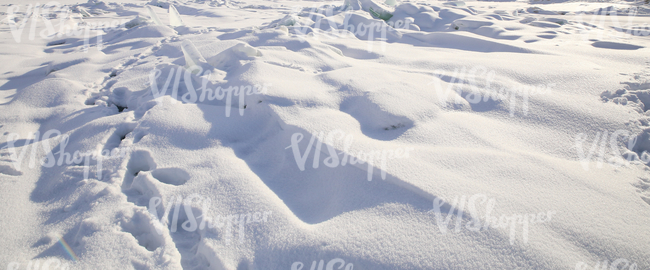 bumpy field of snow with chunks of ice