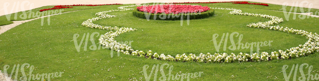 park ground with pink and white formal flowerbeds