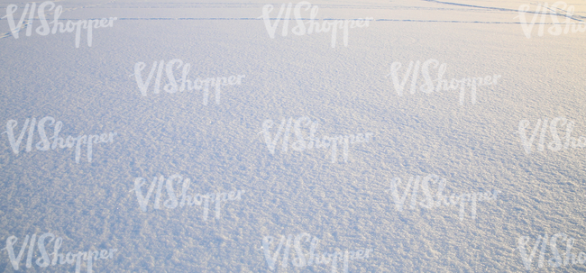 smooth snow field at sunset