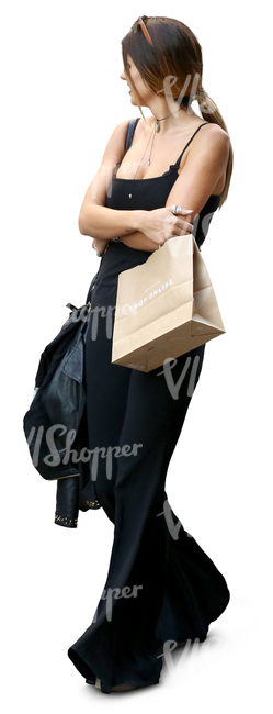 woman in a black outfit and carrying shopping bags