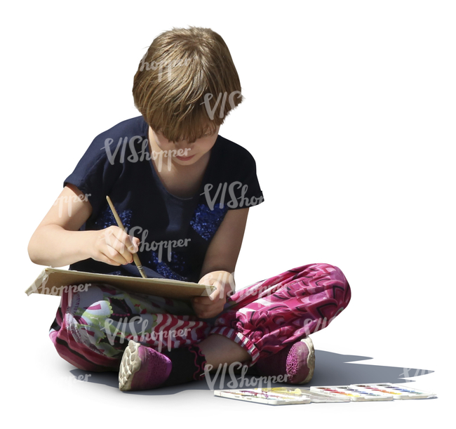 girl sitting on the ground and painting