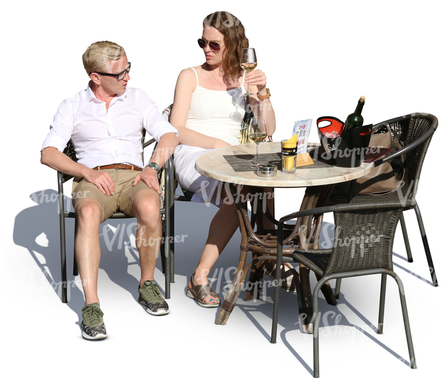 man and woman sitting in a cafe and drinking wine