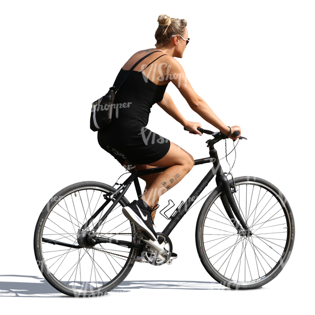 woman in a black dress riding a bicycle
