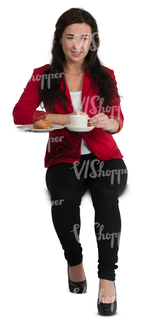 woman sitting at a cafe table and drinking coffee