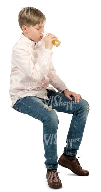 boy sitting in a cafe and drinking juice