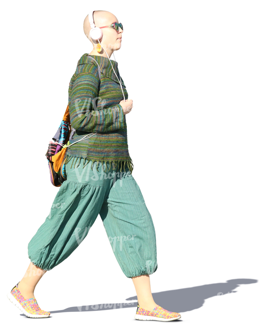 woman with headphones walking on the street