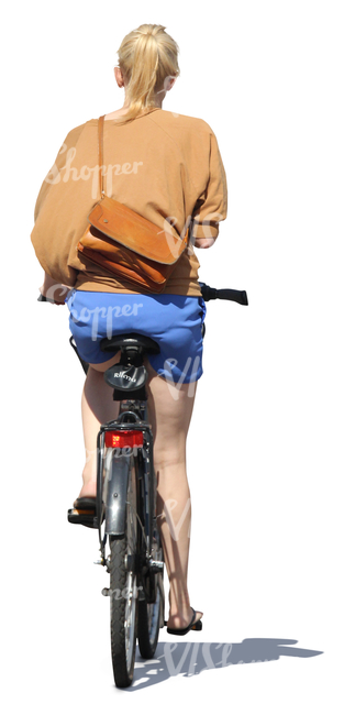 woman riding a bike in the summertime