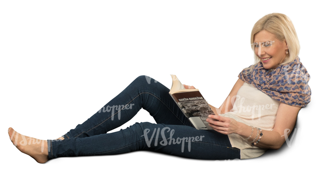 woman sitting on a sofa and reading a book