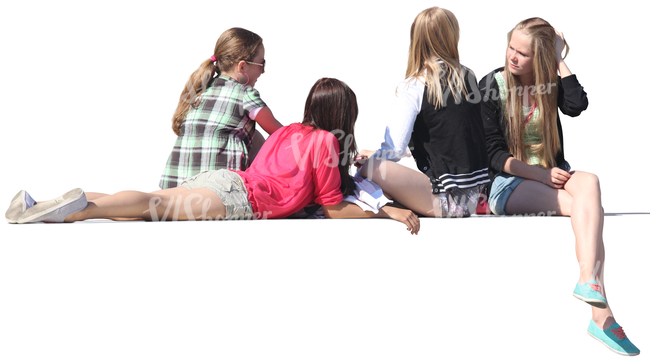 four girls sitting on a balustrade