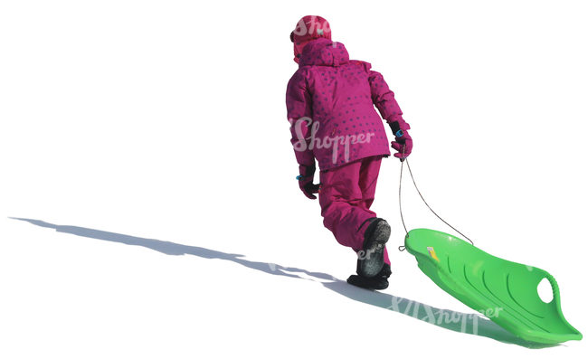 little girl with a sledge walking up the hill