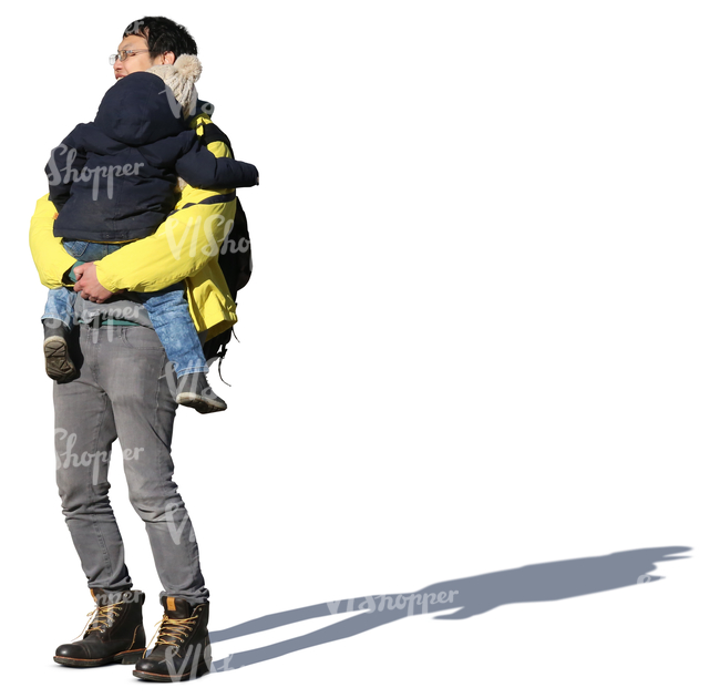 asian man standing and holding his daughter in his arms