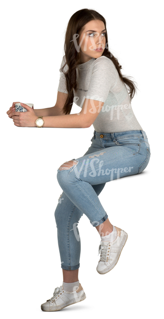 young woman siting in a cafe and drinking tea