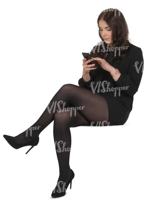 woman in a black costume sitting and texting