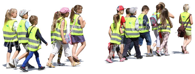 group of children wearing reflector vests walking