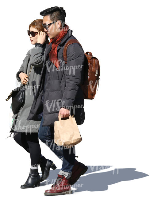 asian couple walking in the springtime