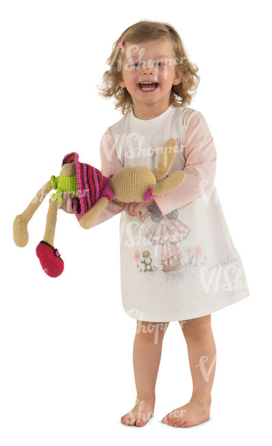 little girl in a pink dress playing with her toy rabbit