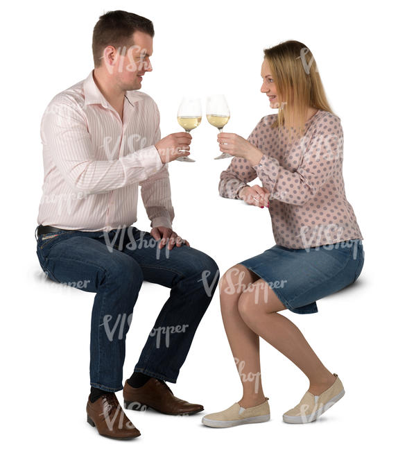 man and woman sitting in a cafe and drinking wine