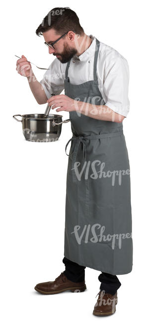chef standing in the kitchen and tasting soup