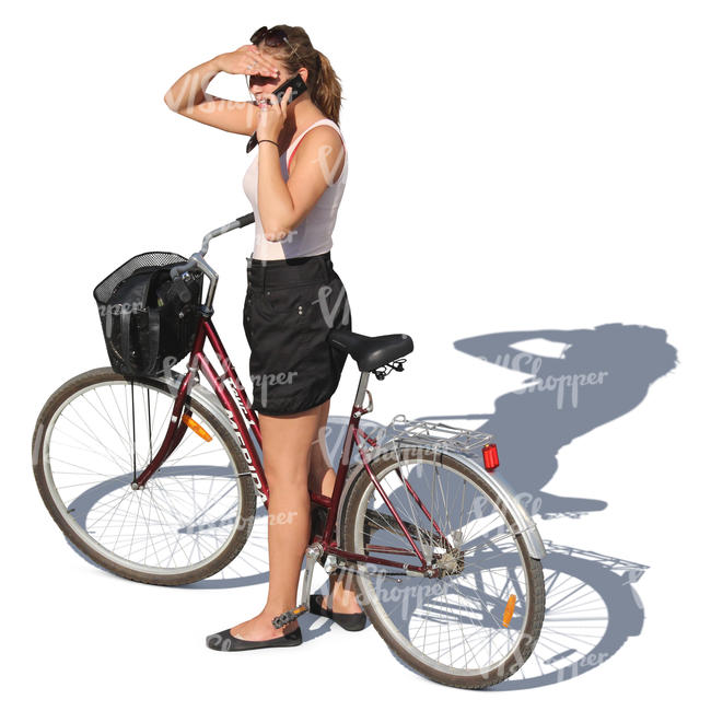 woman with a bicycle talking on a phone