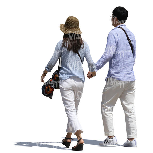 asian couple walking hand in hand on a sunny street