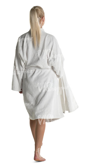 woman in a white bathrobe walking