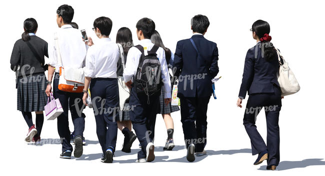 group of asian schoolchildren walking on the street