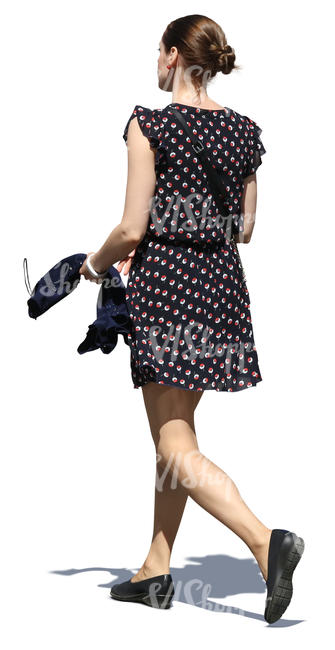 woman in a short summer dress walking in sunlight