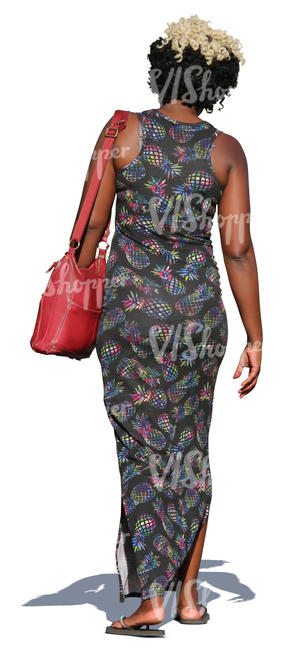 cut out african woman in a long dress walking