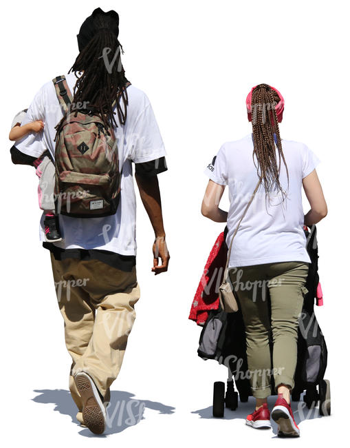 man and woman walking with a baby