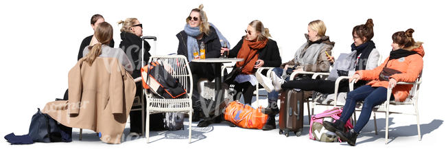 group of women sitting in a street cafe