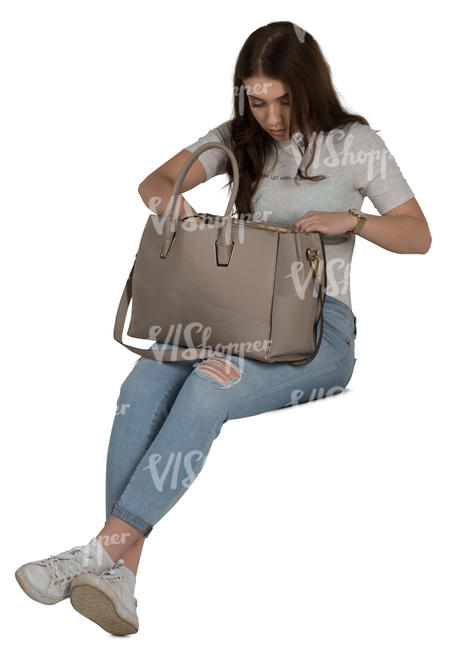 woman sitting and looking for smth from her bag