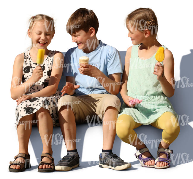 three children sitting and eating ice cream
