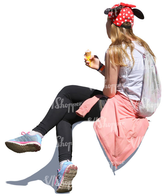 girl sitting and eating ice cream