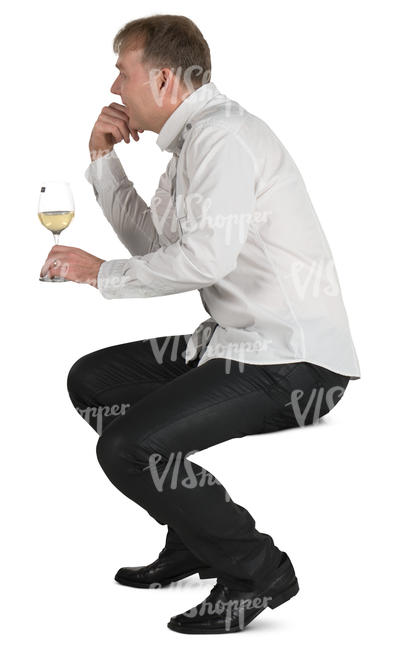man sitting in a cafe and drinking white wine
