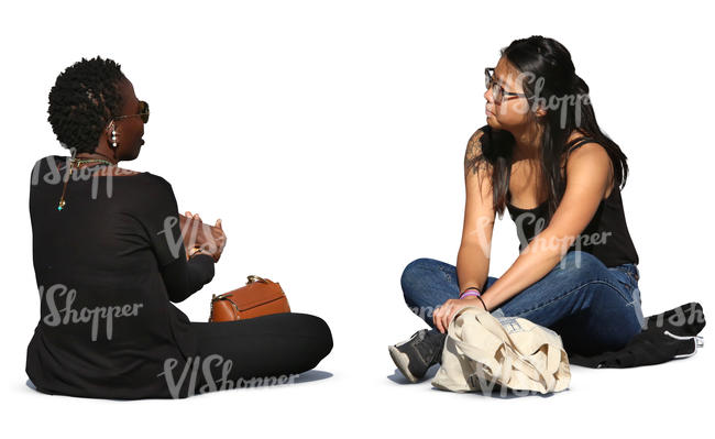 asian and african woman sitting and talking