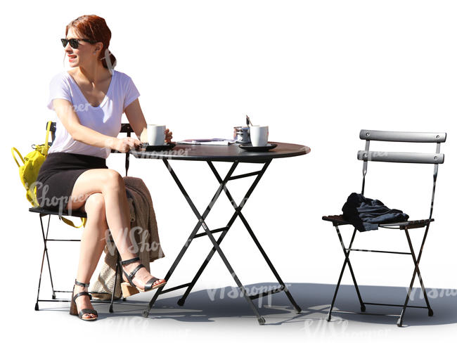 woman sitting in a street cafe