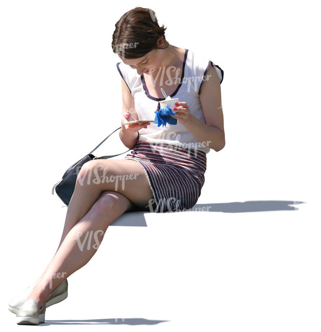 woman sitting and eating ice cream