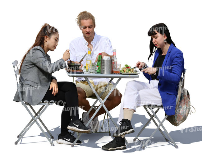 three people sitting in a cafe and eating