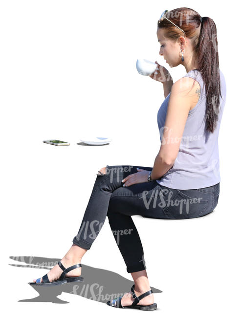 woman sitting in a cafe and drinking coffee