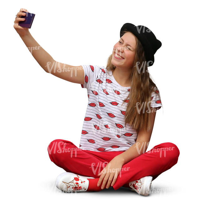 girl sitting and taking a selfie